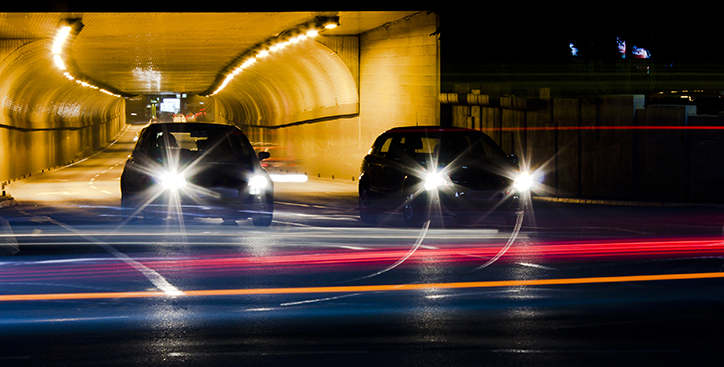 Cars at night with headlights on